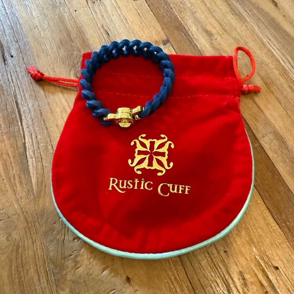 Rustic cuff Navy stretchy band with gold buckle. Like new with dust bag